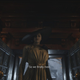 It’s a bit dark, but you can see her shoulders just touch the top of the door which (according to my research) is 86 inches tall.